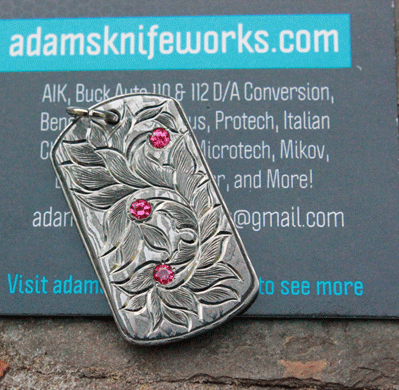 Handmade Engraved Damascus Pendant with Ruby Accents